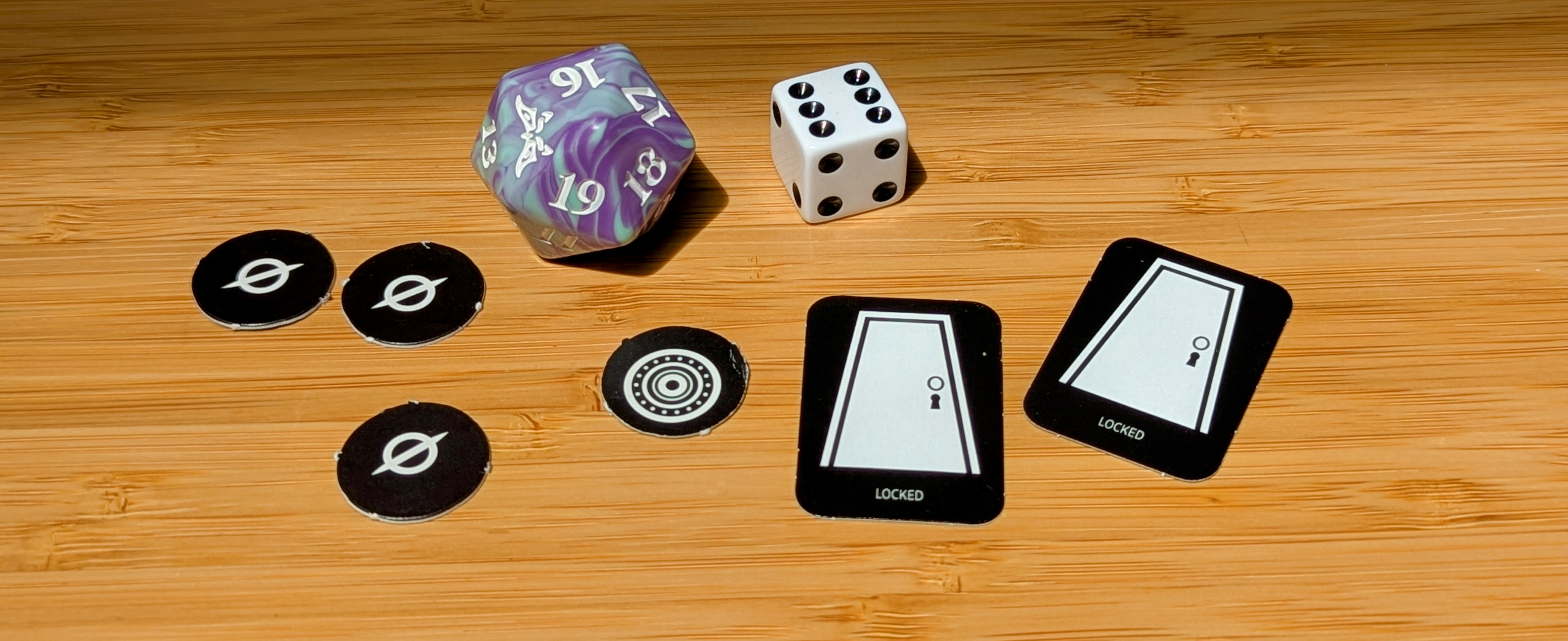 Some of the Magic the Gathering tokens we’ve been using and some dice.